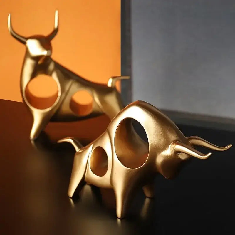 DecorBites™ abstract bull sculpture cattle statue in golden polished metal with hollowed sleek design for home decor