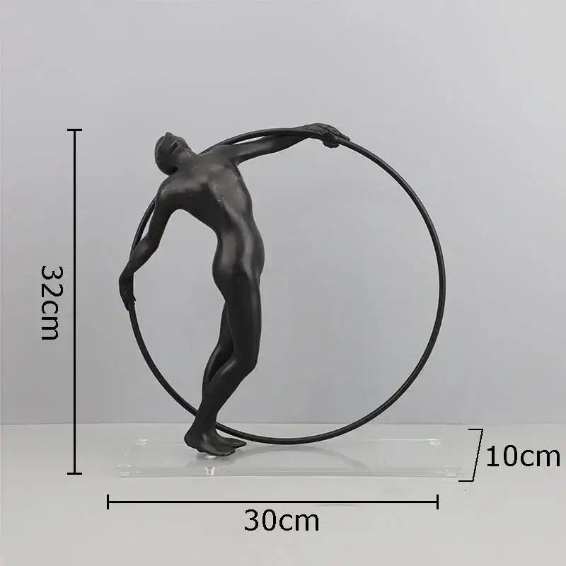 Black matte decorbites abstract cast iron acrobatics sculpture featuring a nude male figure with a circular hoop