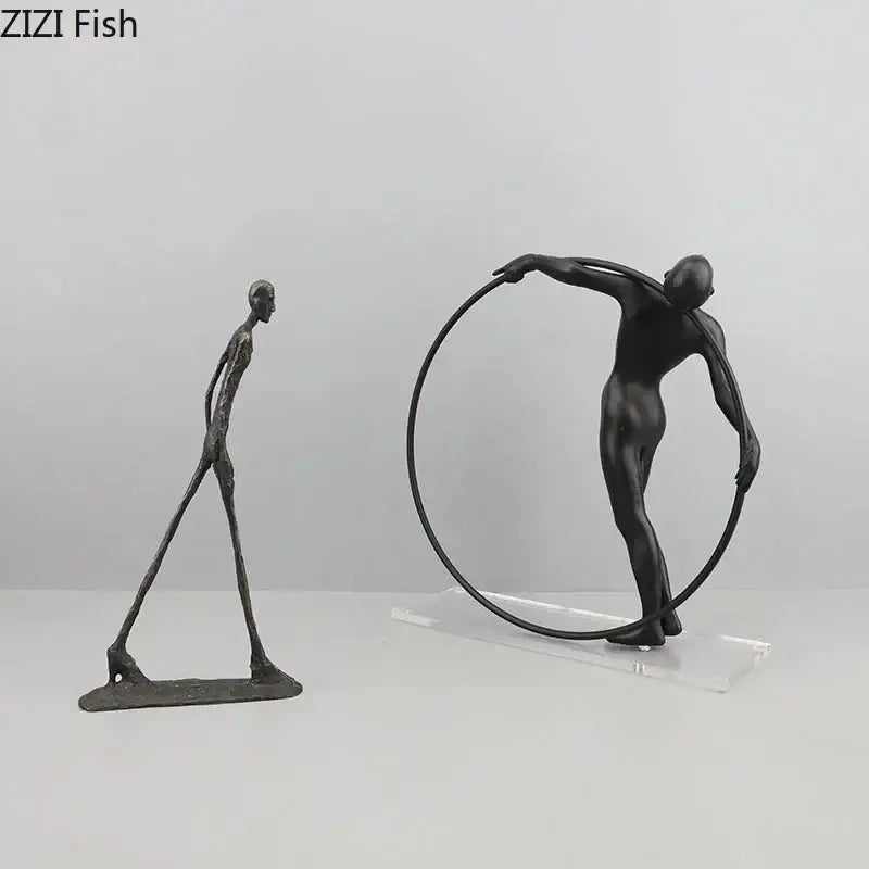 Black metal decorbites abstract cast iron sculpture of a slender figure holding a circular hoop for desk decoration