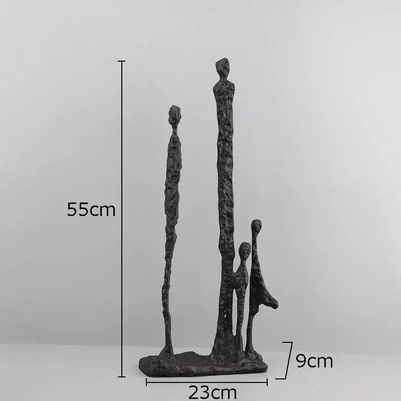 Dark textured decorbites abstract cast iron figure sculpture of three stylized human figures for modern home decor