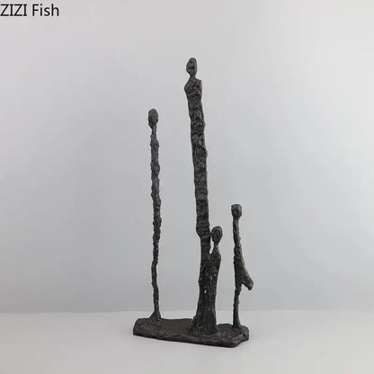 Dark gray textured abstract cast iron figure sculpture of four stylized human forms on rectangular base decorbites abstract cast
