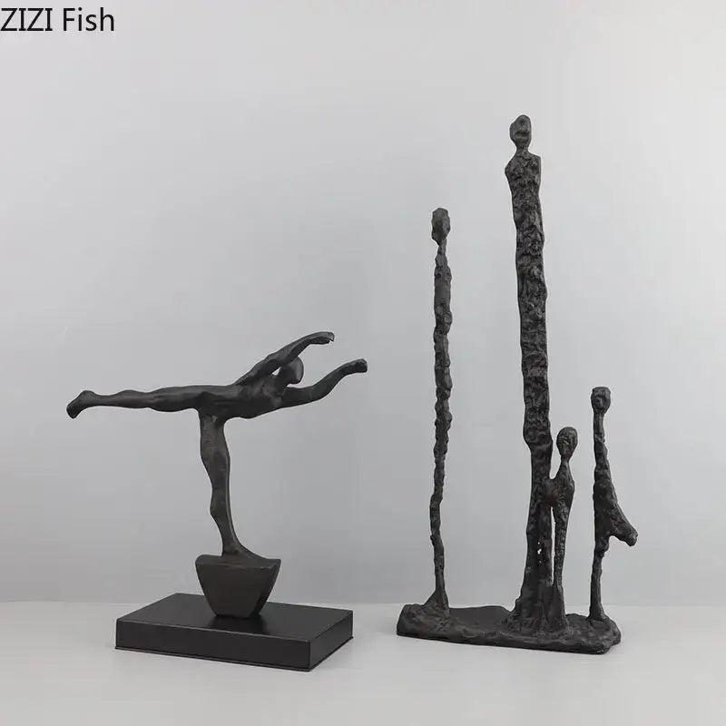 Decorbites abstract cast iron figure sculpture in black matte finish depicting a dancer in mid-leap pose on base