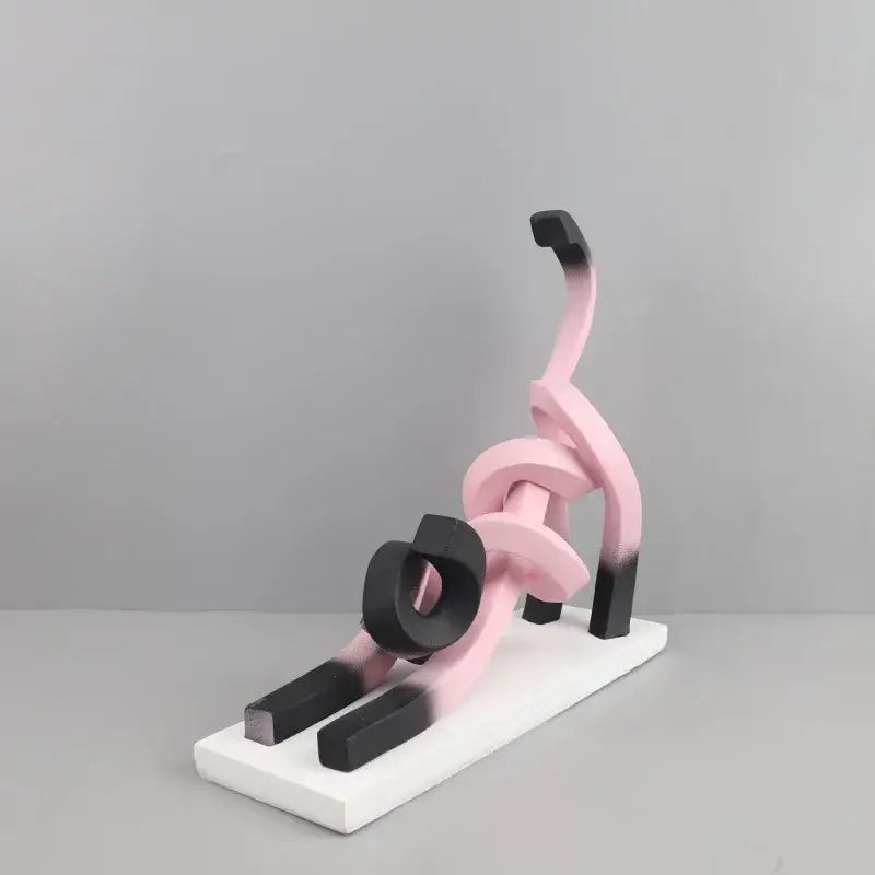 Decorbites abstract cat resin sculpture with flowing pink and black gradient geometric forms on white base for decor