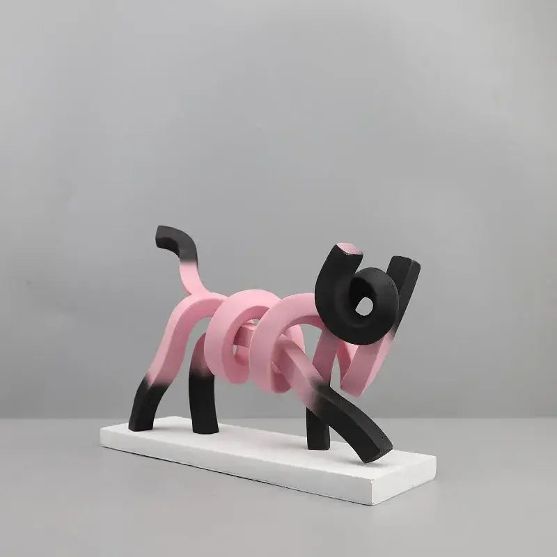 Decorbites abstract cat sculpture featuring a pink and black gradient resin dog figurine on a white base for kids room decor