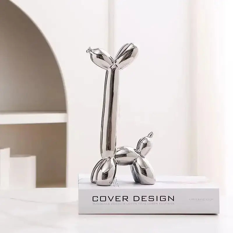 Decorbites abstract ceramic balloon dog sculpture in shiny silver with sleek reflective surface for home office décor