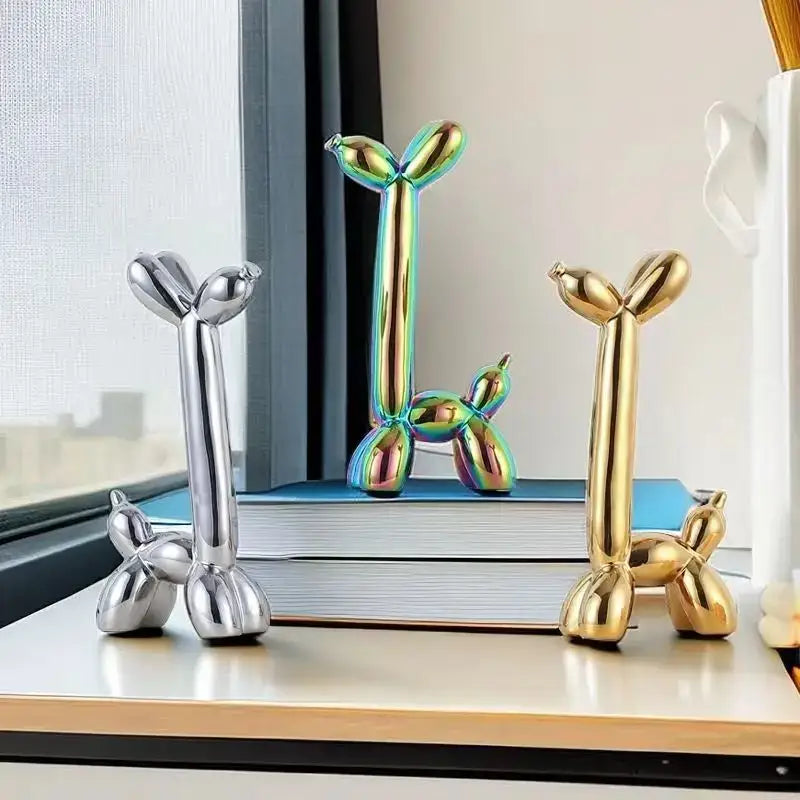Decorbites abstract ceramic balloon dog sculptures in silver iridescent green and gold finishes for home office décor