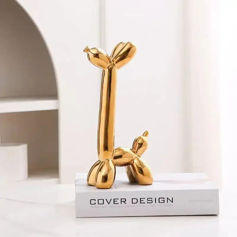 Golden decorbites abstract ceramic balloon dog sculpture with a sleek reflective surface for home office décor