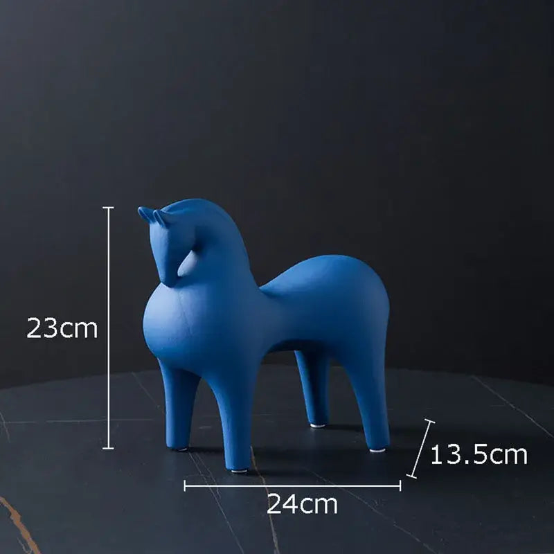 A sleek matte blue abstract ceramic horse decorative figurine by DecorBites with minimalist smooth contours