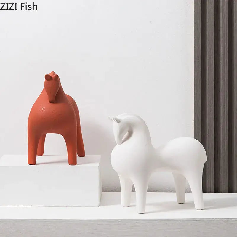 Two minimalist terracotta and white decorative figurines featuring decorbites abstract ceramic horse sculptures