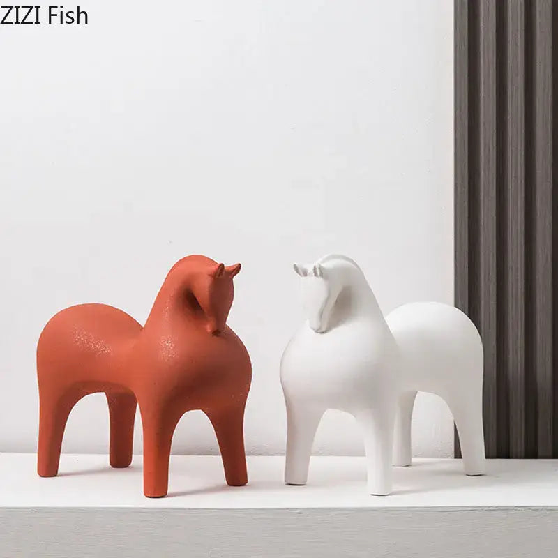 Two minimalist decorative figurines in terracotta orange and matte white by DecorBites abstract ceramic horse sculpture