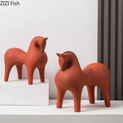 Two terracotta abstract ceramic horse decorative figurines by DecorBites with a smooth minimalist design