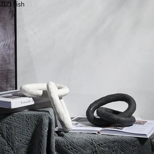 DecorBites abstract ceramic knot sculpture in white and black with a matte textured finish for room aesthetic decor