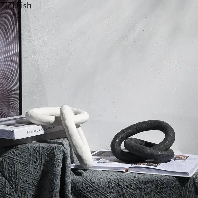DecorBites abstract ceramic knot sculpture in white and black with a matte textured finish for room aesthetic decor