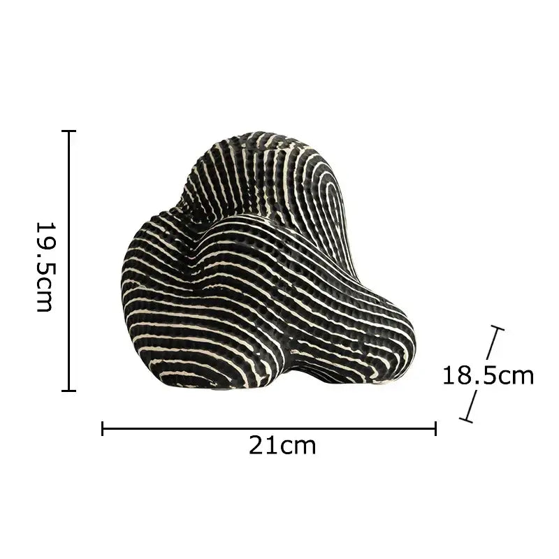 A sleek black and white striped decorbites abstract ceramic rockery sculpture ornament for desk decoration