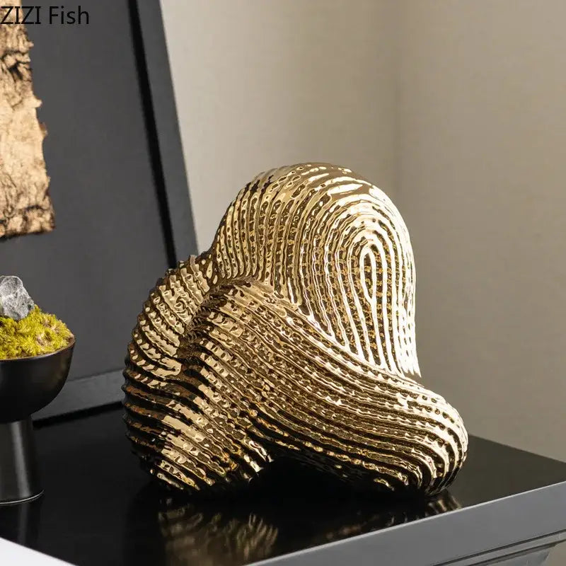 Golden decorbites abstract ceramic rockery sculpture ornament with intricate swirling texture for desk decoration