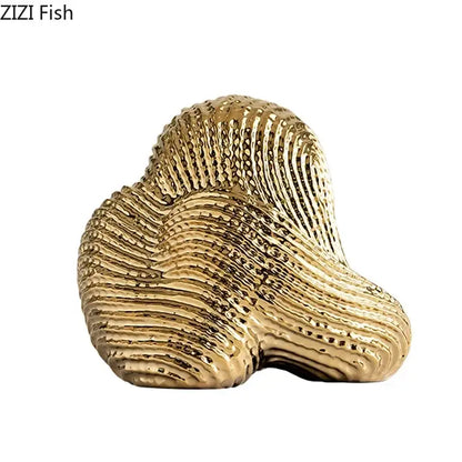 Golden glossy decorbites abstract ceramic rockery sculpture ornament with intricate shell texture for desk decoration