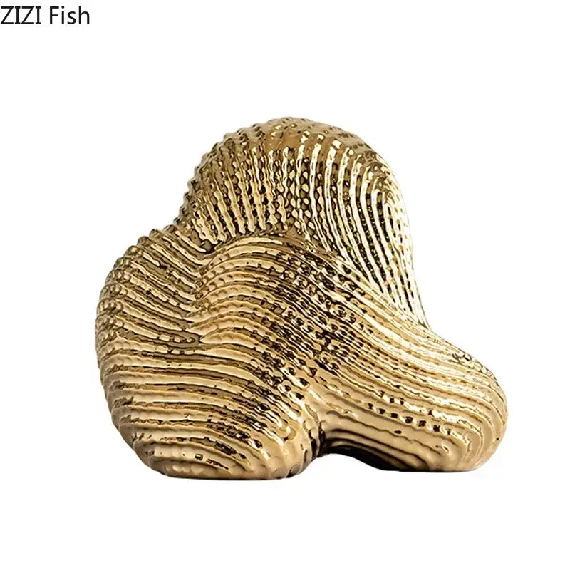 Golden glossy decorbites abstract ceramic rockery sculpture ornament with intricate shell texture for desk decoration