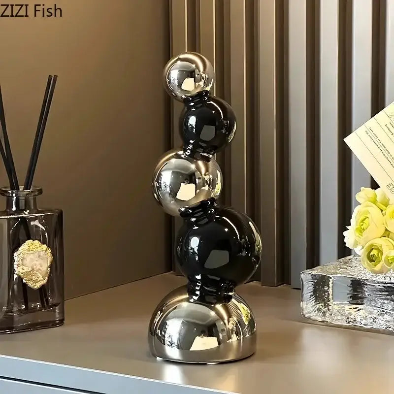 Modern black and chrome spherical decorbites abstract ceramic sculpture with a glossy finish for desk decoration