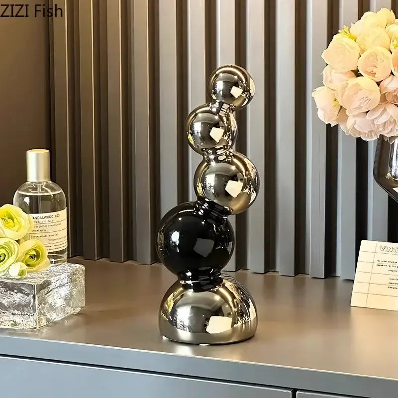 Shiny black and silver DecorBites abstract ceramic stacked sphere sculpture for modern desk decoration and room aesthetics