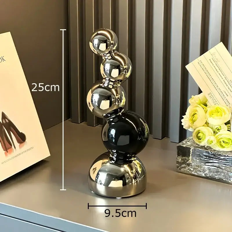Decorbites abstract ceramic sculpture featuring five polished silver and black spheres for modern desk decoration