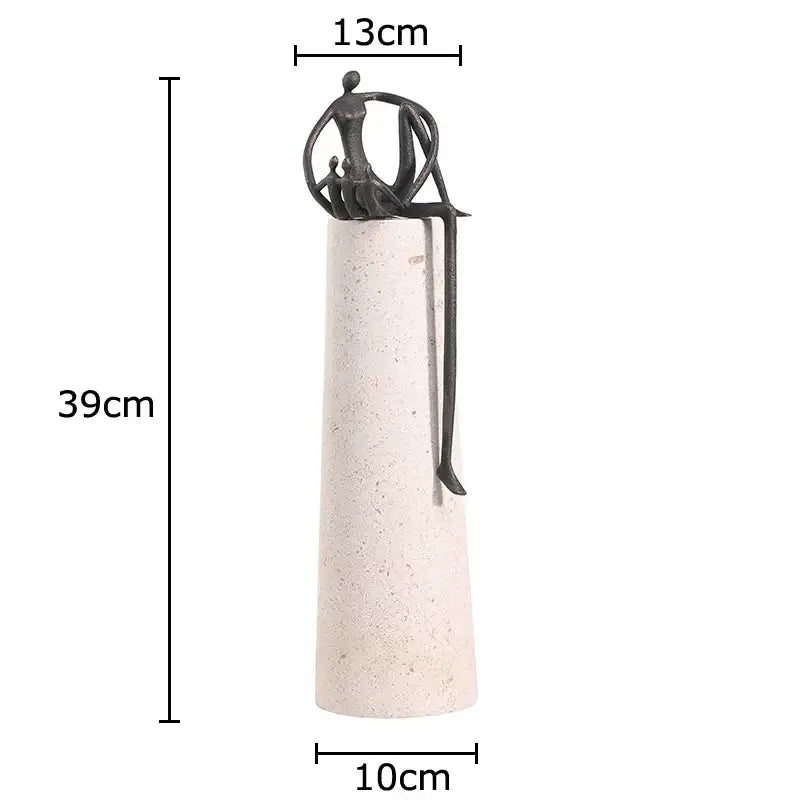 A sleek dark metal abstract character marble sculpture on a textured off-white pedestal for marble sculpture room decor