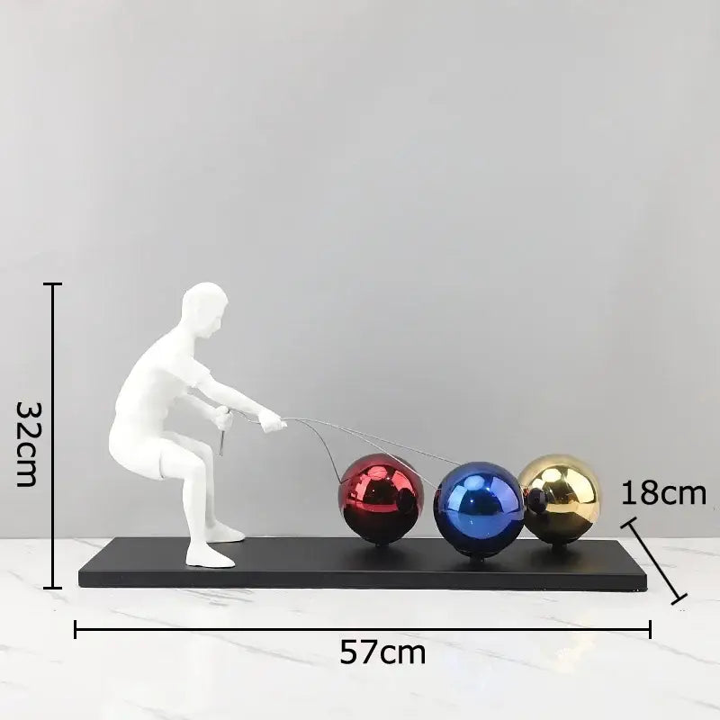 White resin decorbites abstract character metal sculpture with red blue and gold spheres on black base for room decor