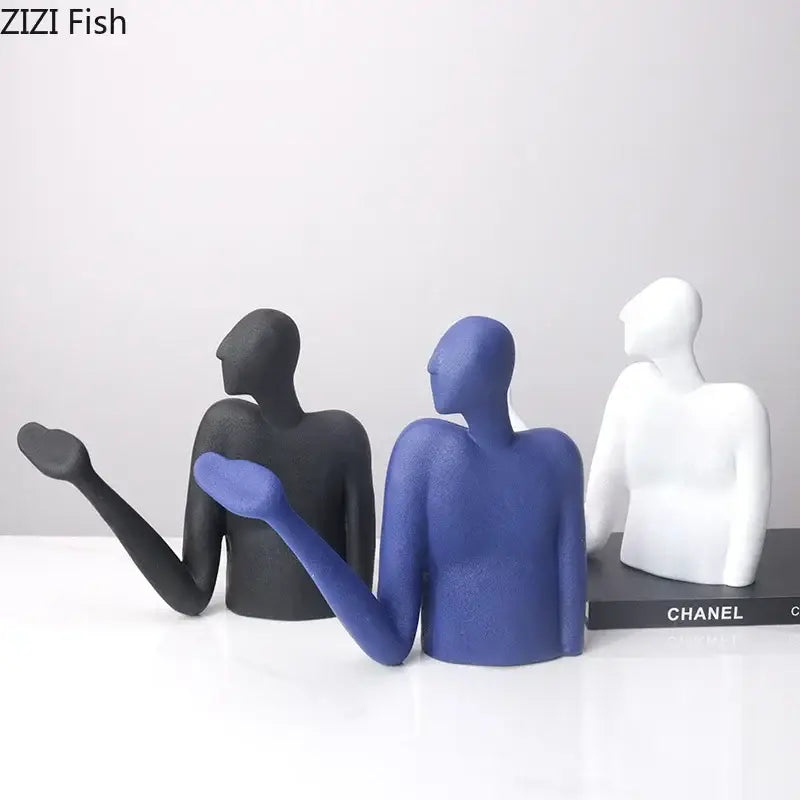 Set of three minimalist abstract character resin figurines in matte black, royal blue, and white for desk decoration by decorbites