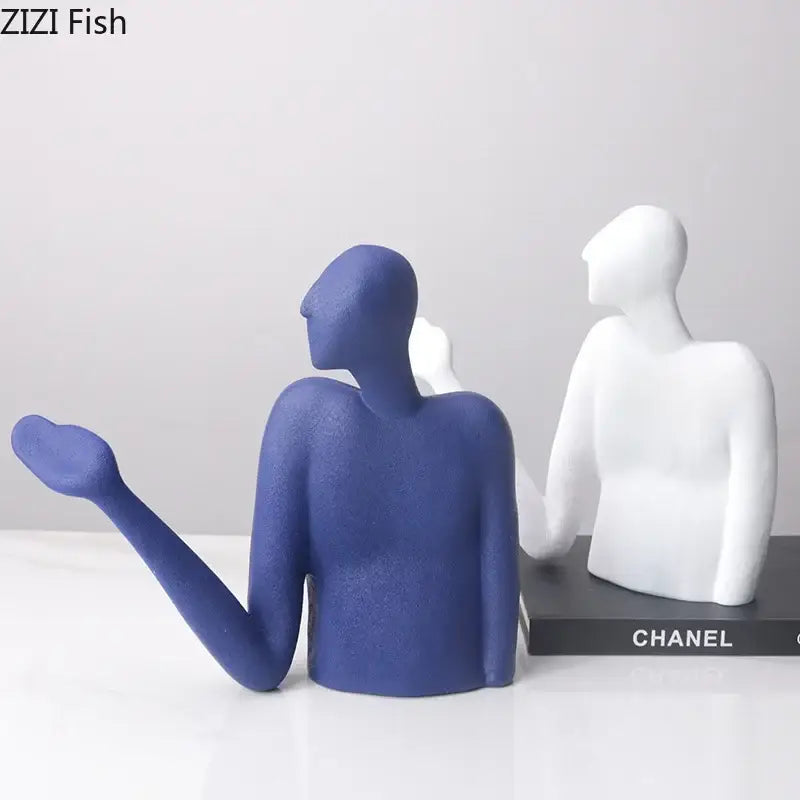 Blue and white decorbites abstract character resin sculpture with smooth matte finish as modern desk decoration