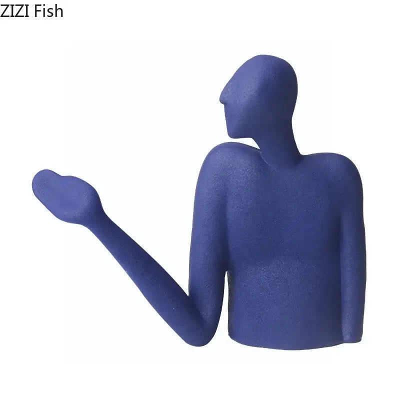Blue matte-finished decorbites abstract character resin sculpture with one arm extended for modern desk decoration