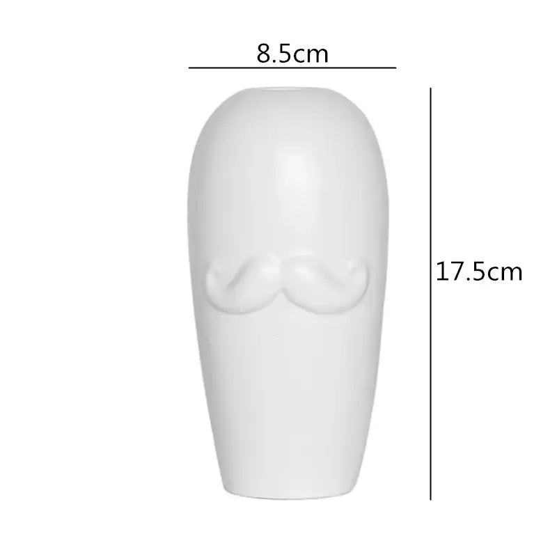 White ceramic vase with sculpted mustache design from decorbites abstract character white ceramics collection