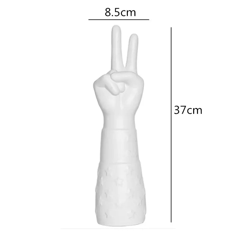Decorbites abstract character white ceramics vase featuring a handcrafted white ceramic hand peace sign with textured forearm