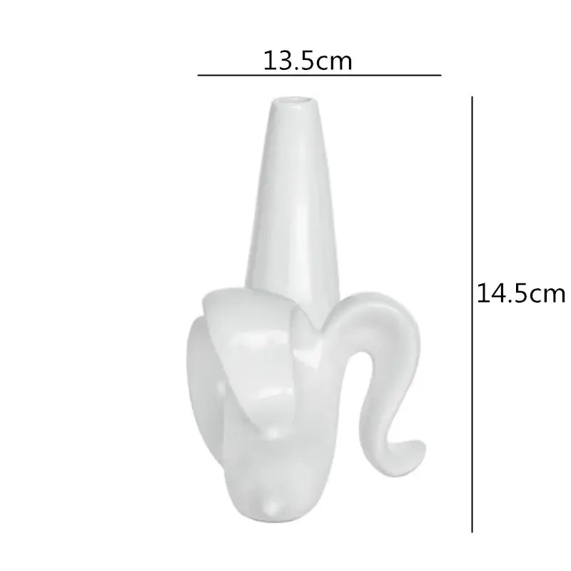 A sleek glossy white ceramic vase shaped like a banana peel for decorbites abstract character home decor