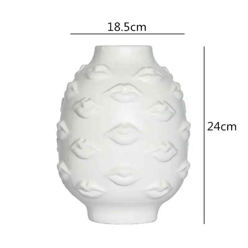 A white ceramic vase with embossed lips texture from decorbites abstract character for modern home decor