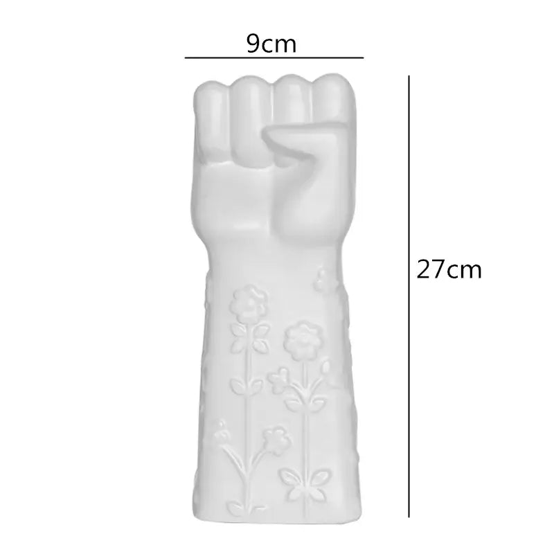 Decorbites abstract character white ceramics vase shaped like raised fist with floral and butterfly embossed details
