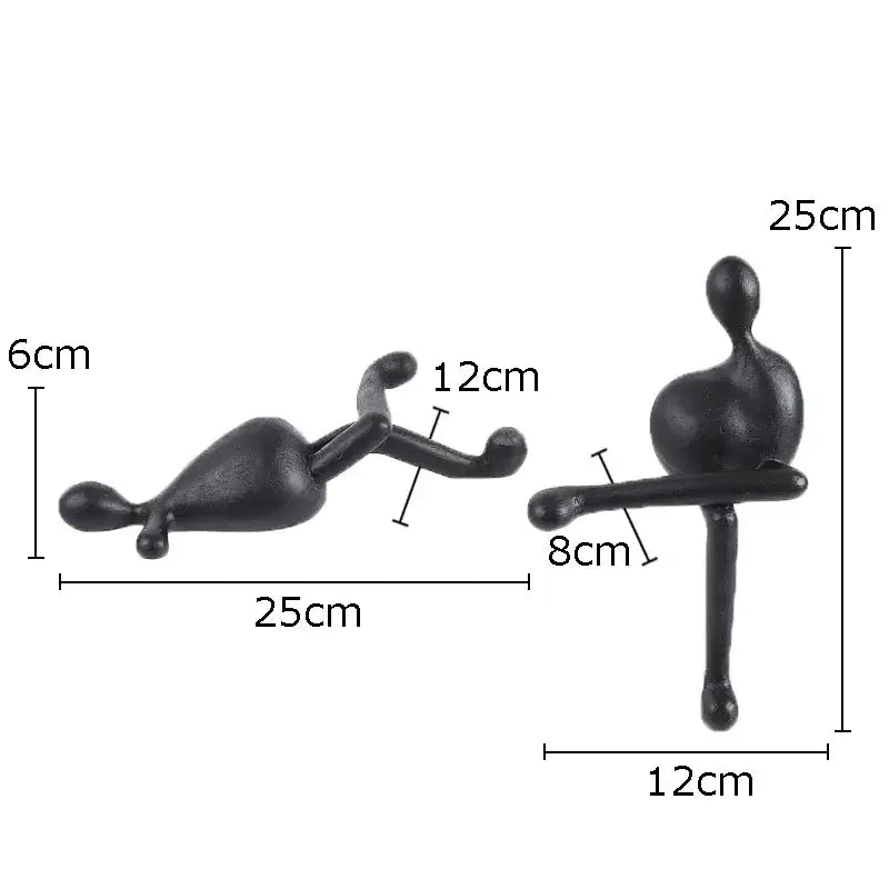 Black matte abstract characters resin sculptures by DecorBites featuring reclining and seated figures for modern decor