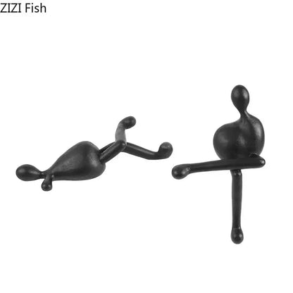 DecorBites abstract characters resin sculpture featuring black matte finish reclining and seated figures for modern decor
