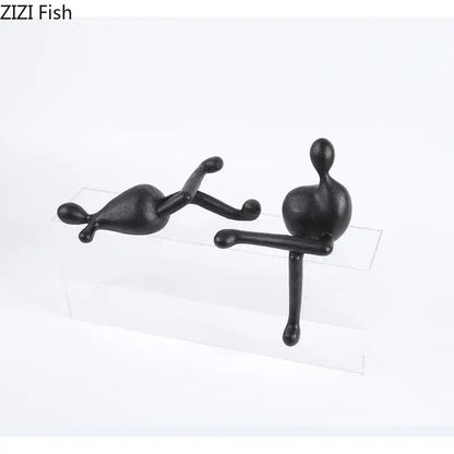 Black minimalist decorbites abstract characters resin sculpture of two playful human-like forms for modern decor