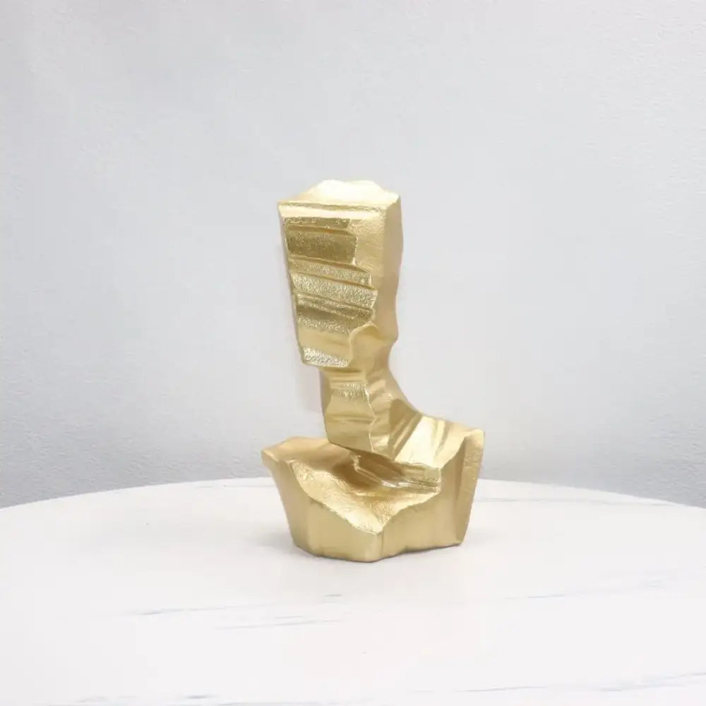 Golden abstract characters sculpture bust with angular facets and textured surface for modern decorbites decoration
