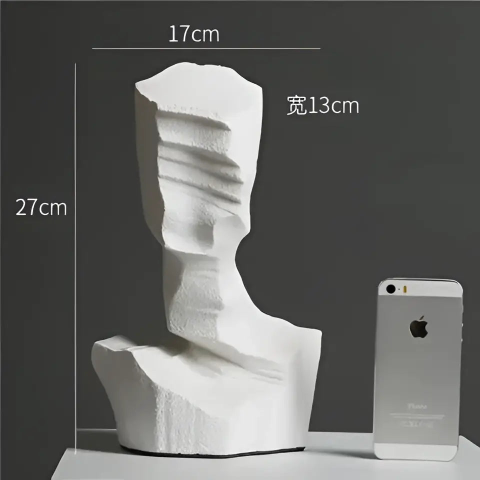 White decorbites abstract characters sculpture with textured layered surface and angular contours for modern decor