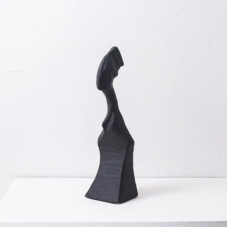 Black matte decorbites abstract characters sculpture with smooth flowing contours for modern living room decor
