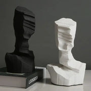 Black and white abstract characters sculpture bookends with textured layered surfaces for modern living room decor by decorbites
