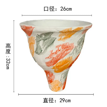 A white ceramic decorbites abstract clay pot with flared rim and colorful orange coral gray brushstrokes for home decor