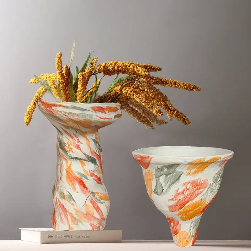 Two decorbites abstract clay colorful ceramic vases with organic forms and bold hand-painted designs for home decor