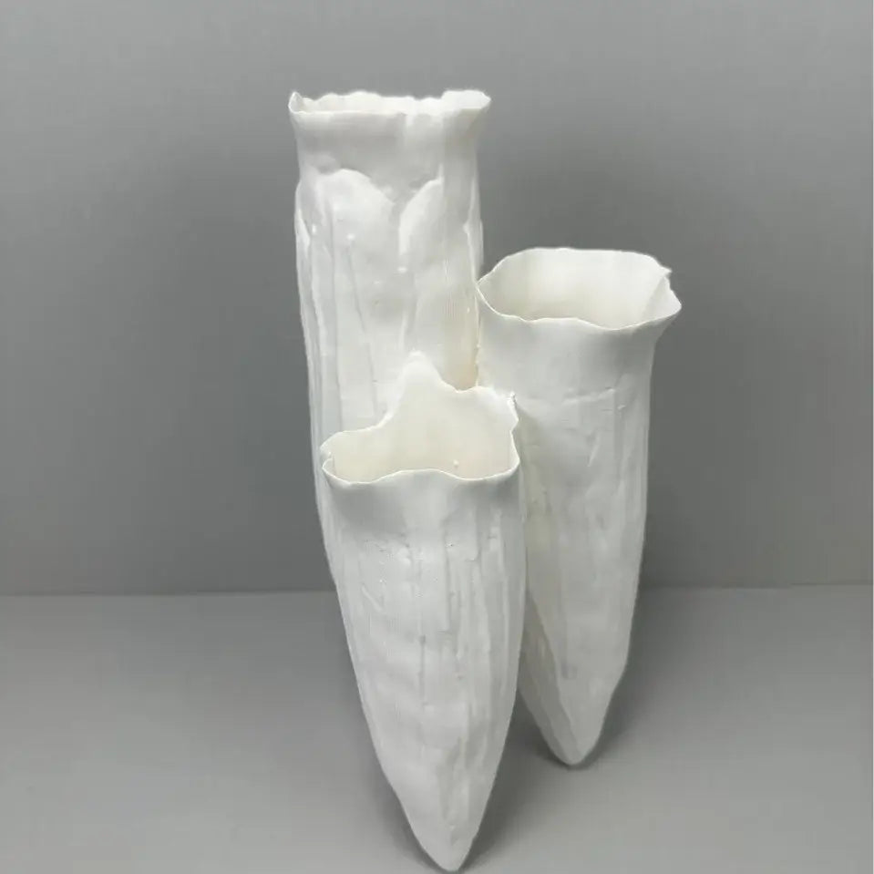 Three white ceramic DecorBites abstract coral reef vases with textured flared rims for home decor display