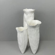Three white ceramic decorbites abstract coral reef vases with textured petal surfaces and flared tops for home decor