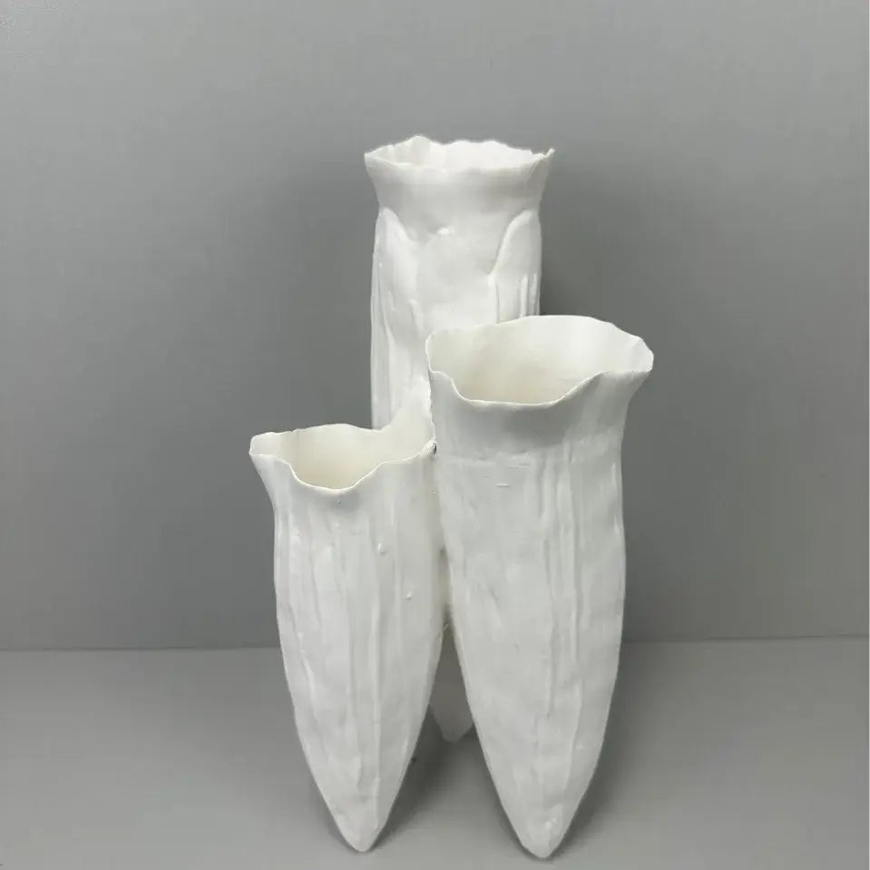 Three white ceramic decorbites abstract coral reef vases with textured petal surfaces and flared tops for home decor