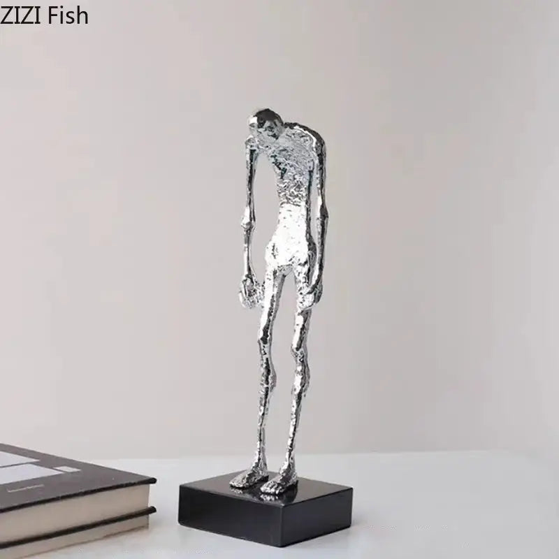 Silver metallic decorbites abstract couple statue on black base for desk decoration and room aesthetics