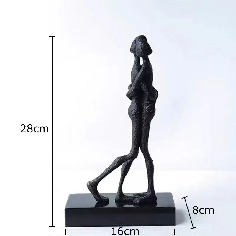 Black abstract couple statue of two figures walking together on a rectangular base for decorbites abstract decor