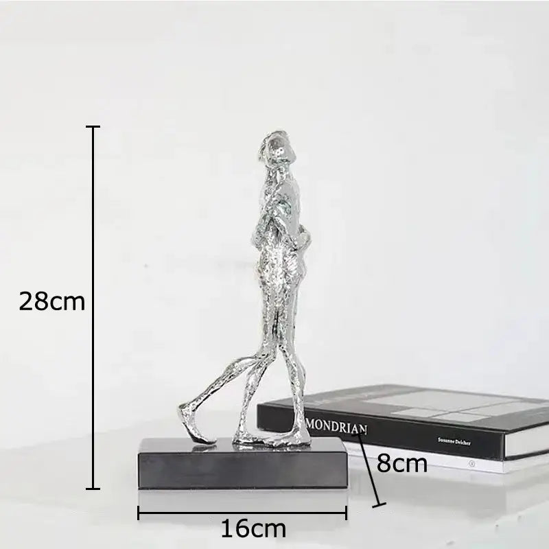 Silver textured decorbites abstract couple statue figurine on black base for desk decoration and room aesthetics
