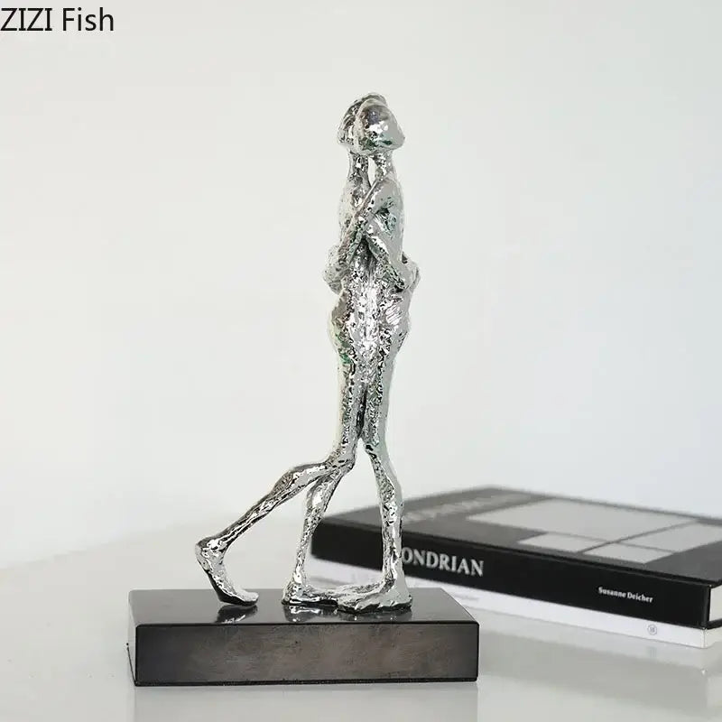 Silver metallic abstract couple statue on black base by DecorBites abstract for desk decoration and room aesthetics